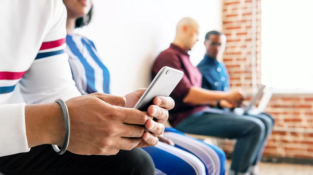 woman on cell phone using new medical app